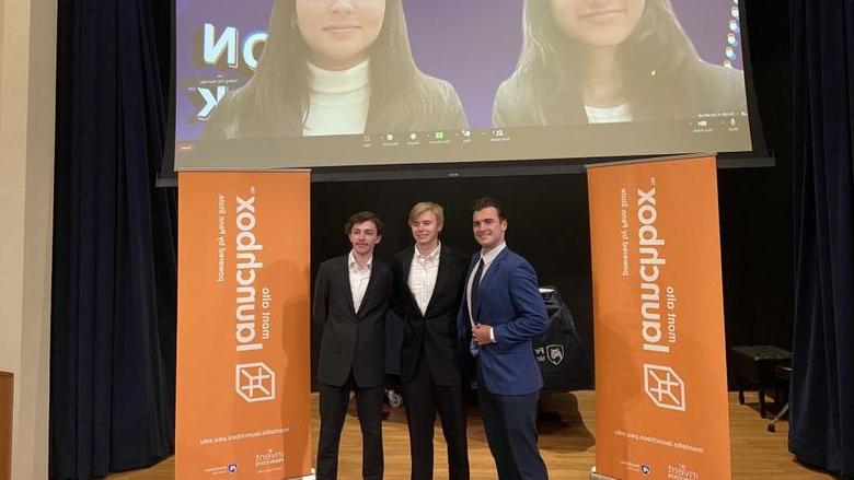 Winners of the 2023 LION Tank Pitch Competition stand and smile in front of 蒙特中音 Launchbox banners.