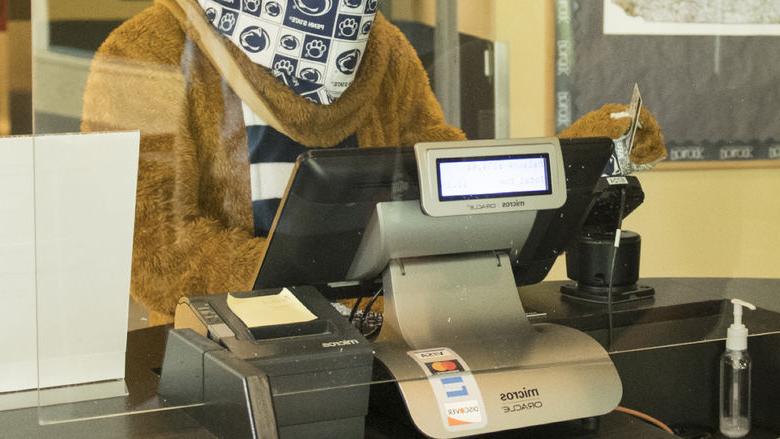 Nittany Lion swiping out hunger at the register in the dining commons